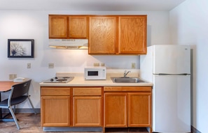 Full-size fridge, microwave, stovetop, freezer