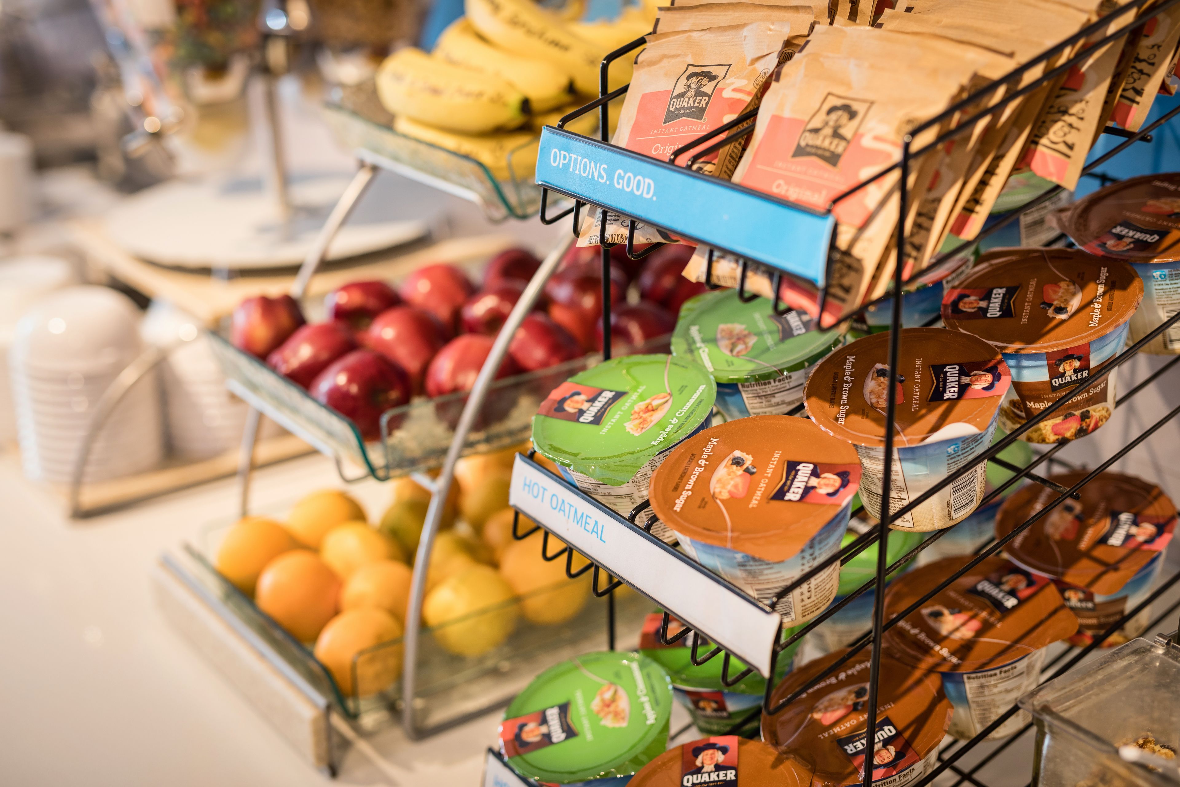 A display of Quaker brand products including oatmeal, hot oatmeal, and other packaged goods.