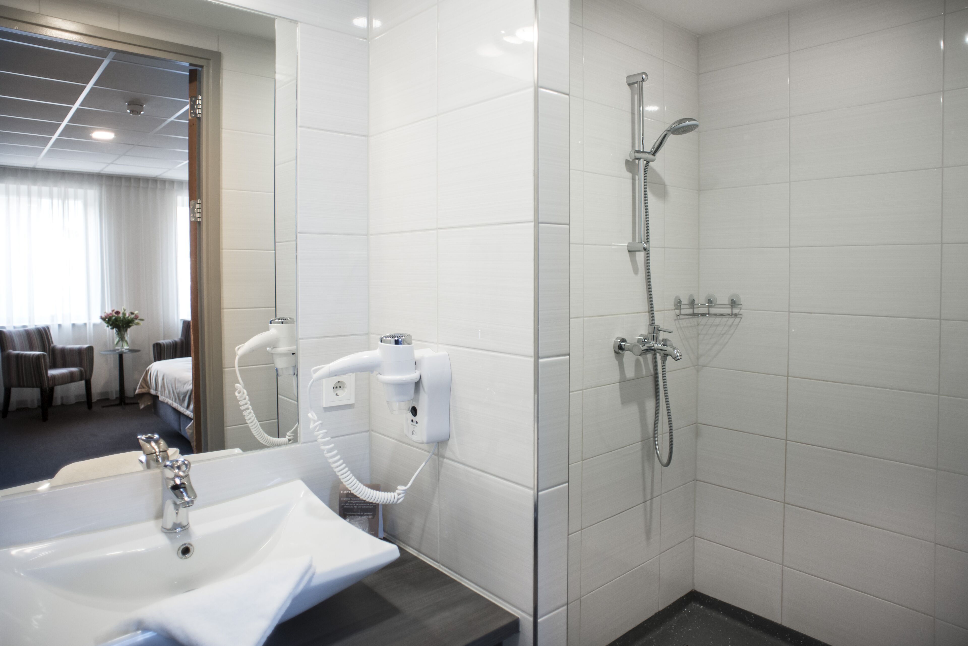 comfort twin room | bathroom | shower, rainfall showerhead, hair dryer, towels