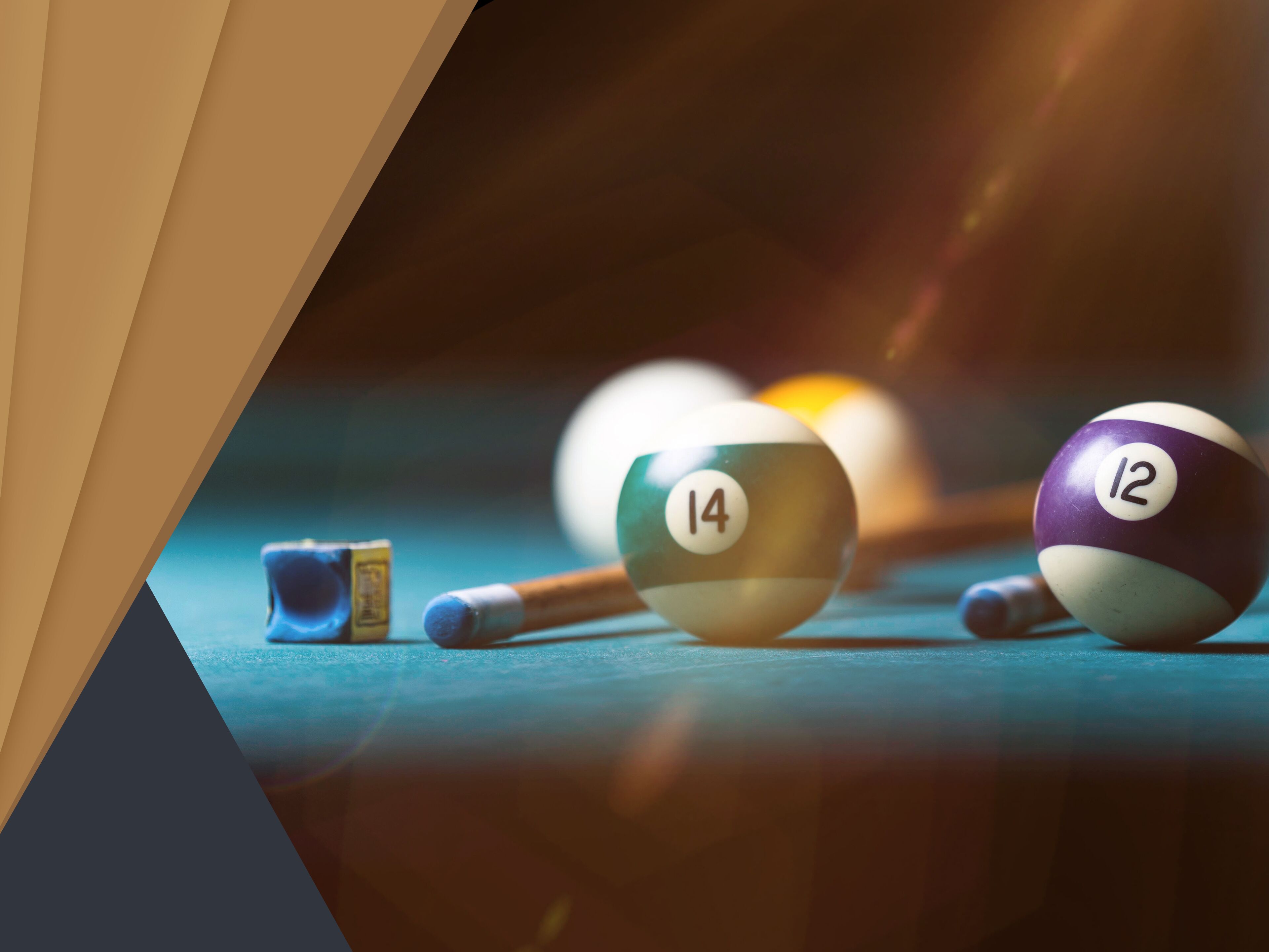 A pool table with billiard balls and cues.