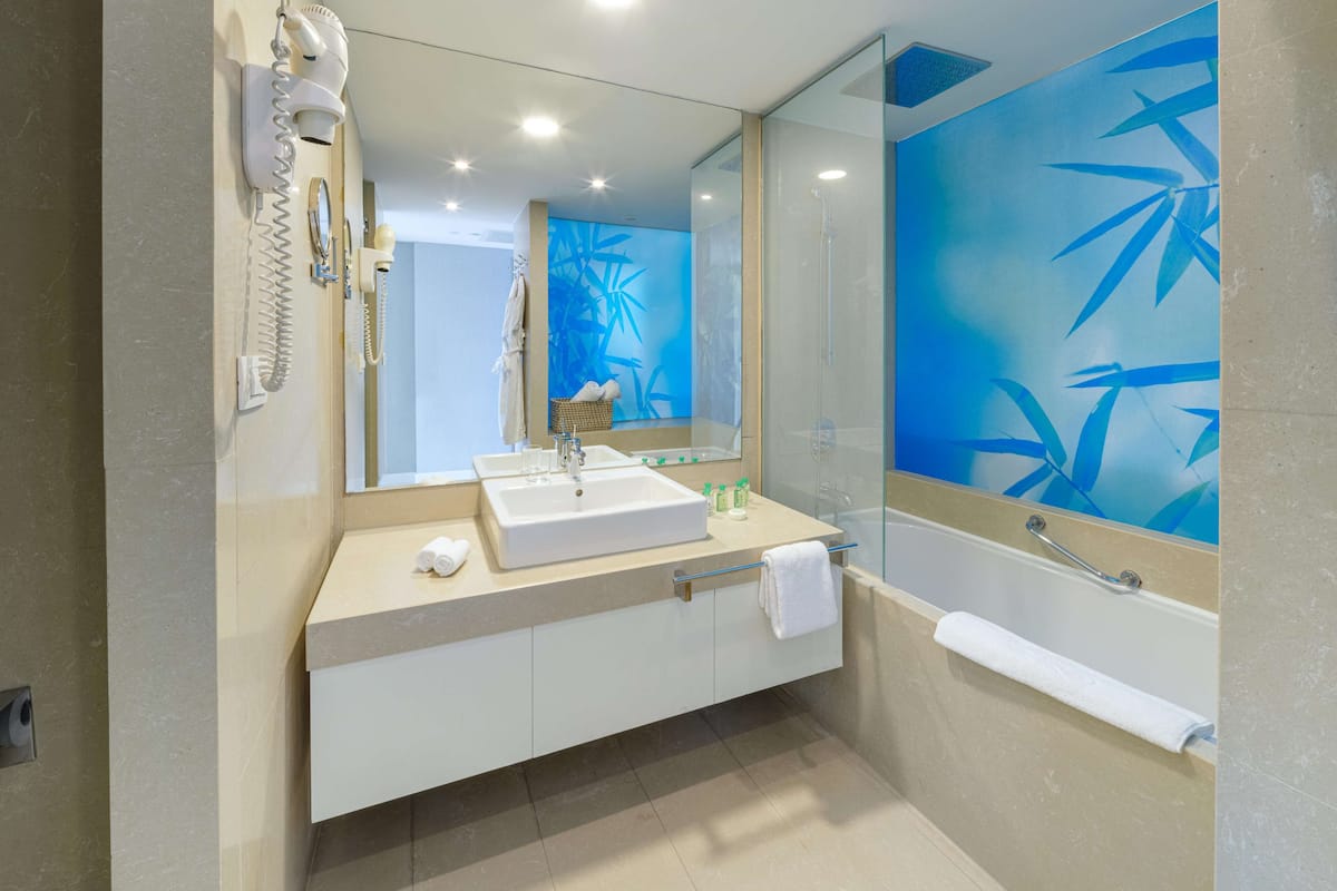 Combined shower/tub, designer toiletries, hair dryer, bathrobes