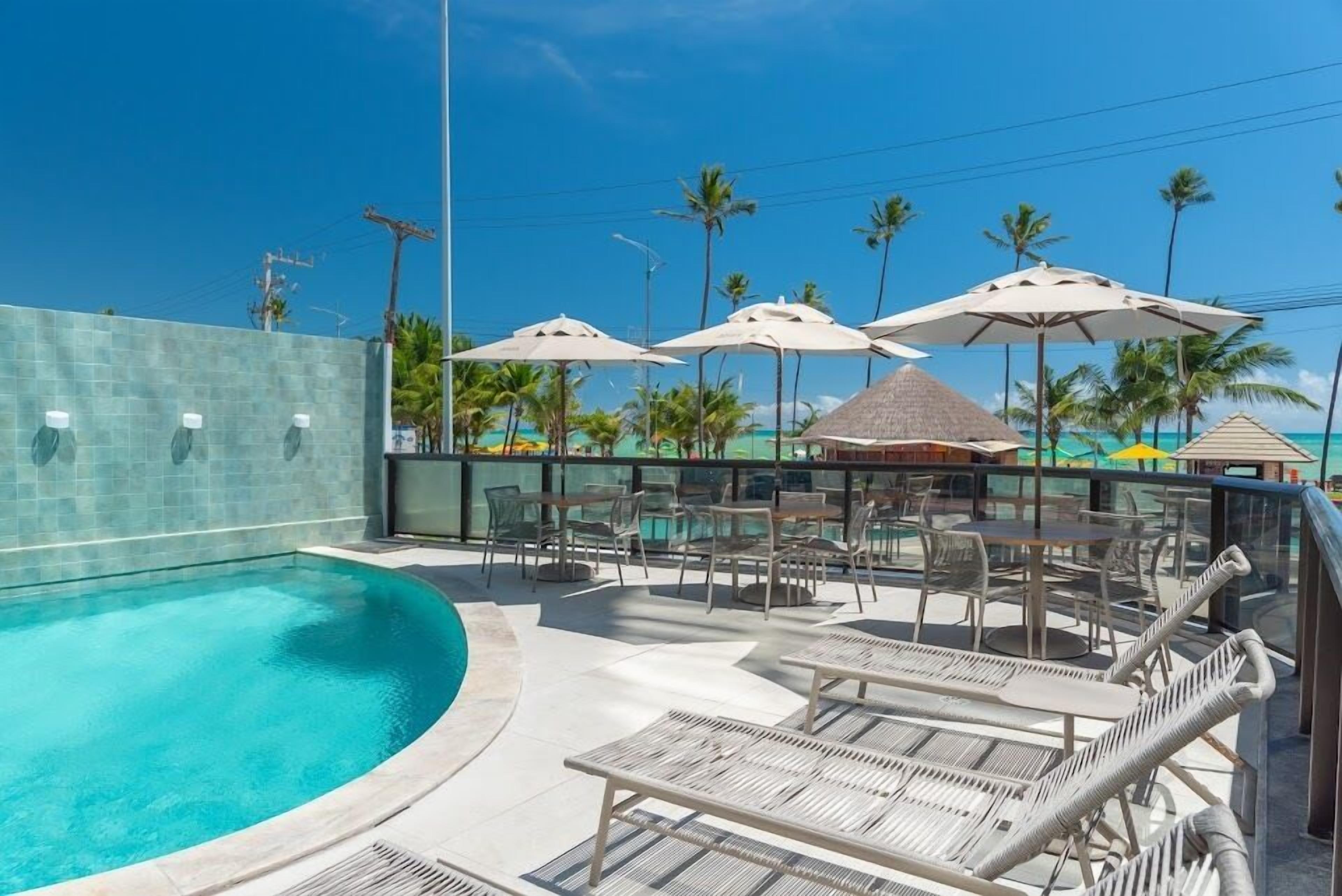 outdoor pool, free pool cabanas, pool umbrellas