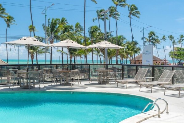 Outdoor pool, free pool cabanas, pool umbrellas
