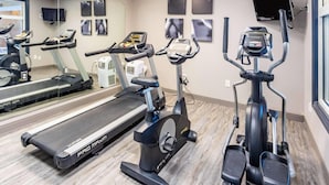 A gym with treadmills, elliptical machines, and a stationary bike. - Country Inn & Suites by Radisson, Smyrna - Atlanta Northwest (Smyrna)
