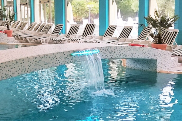 Indoor pool, seasonal outdoor pool, pool umbrellas, sun loungers