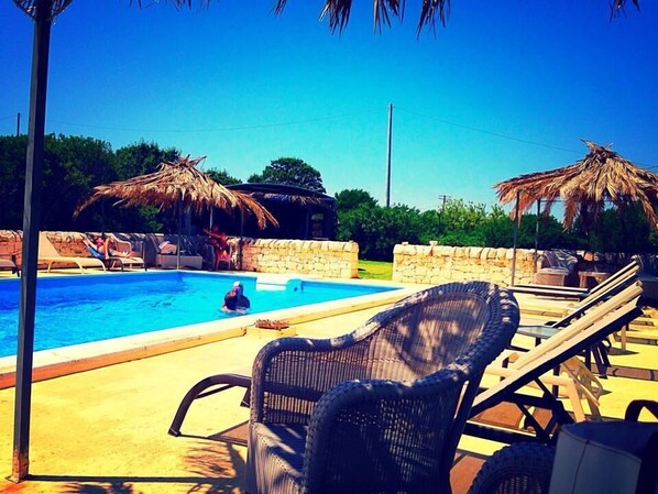 Seasonal outdoor pool, pool umbrellas, pool loungers