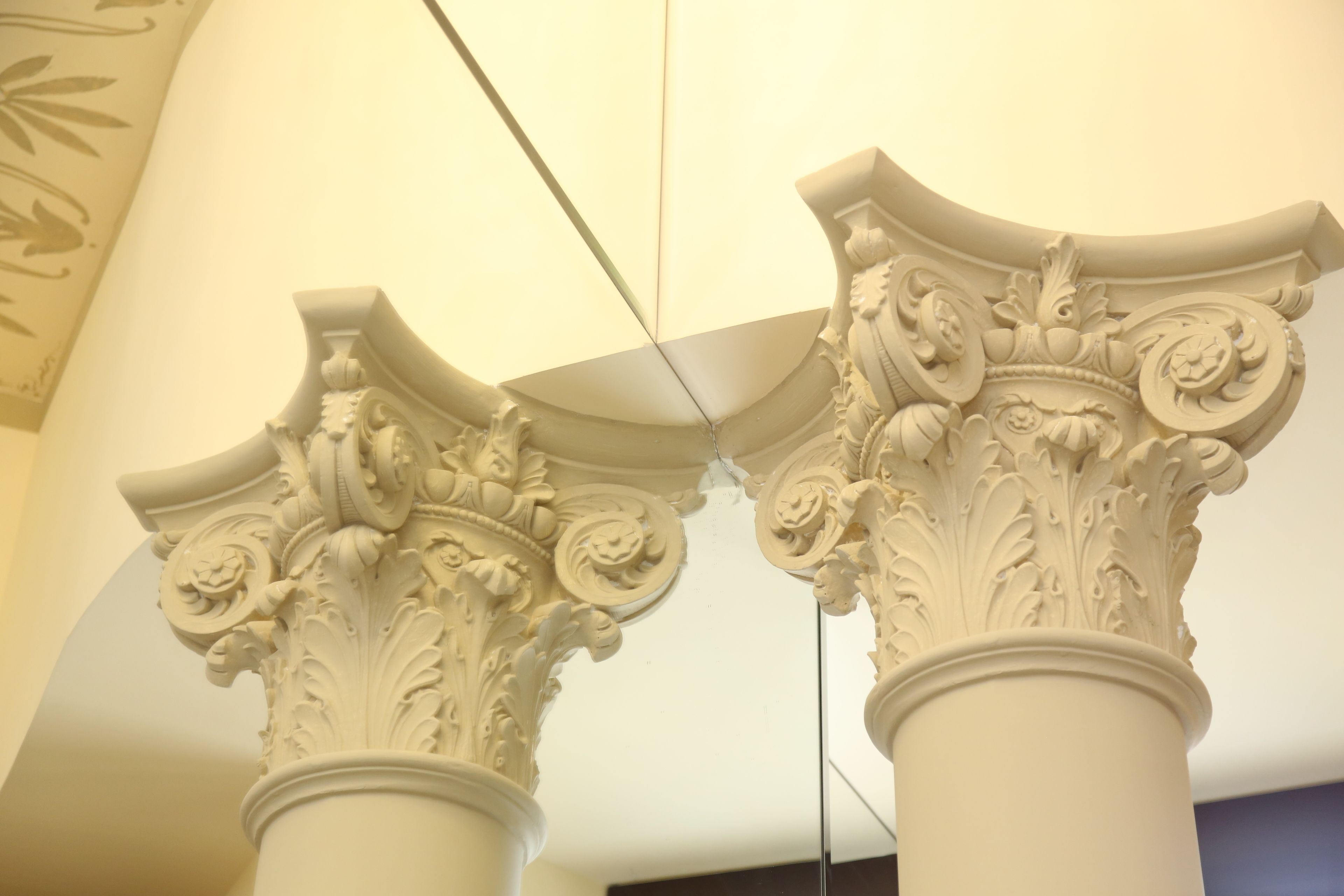 A close-up of ornate architectural columns with intricate carvings.