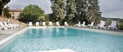 Outdoor pool, pool umbrellas, sun loungers