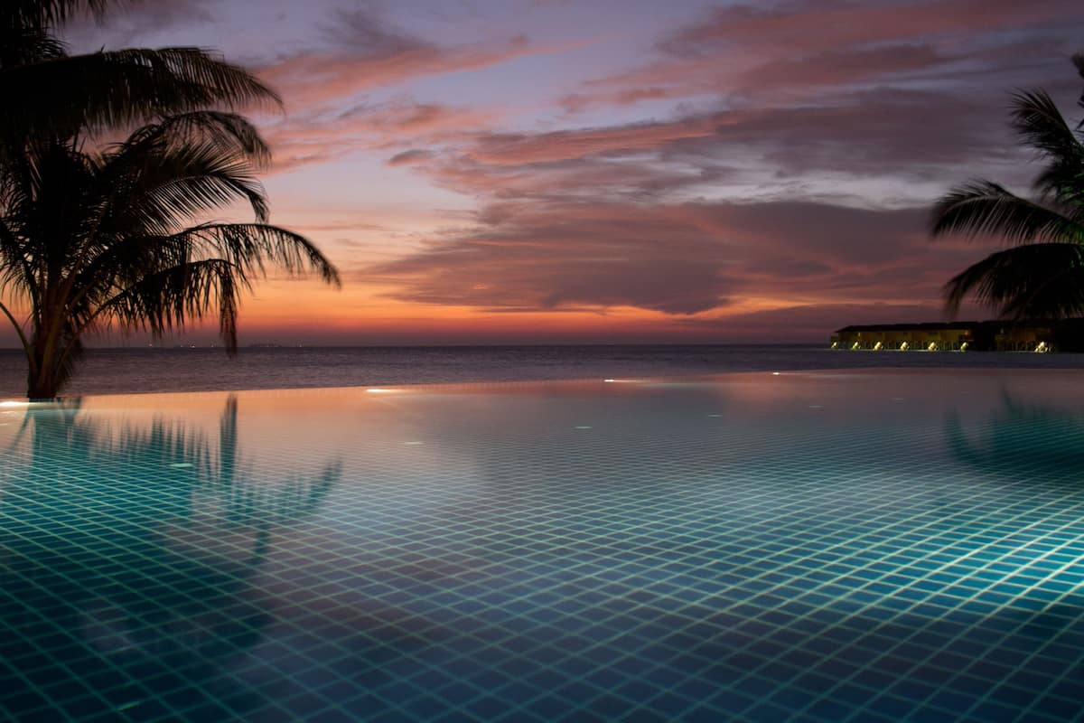 2 outdoor pools, open 6:00 am to 8:00 pm, pool umbrellas, pool loungers