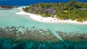 On the beach, white sand, beach towels, windsurfing