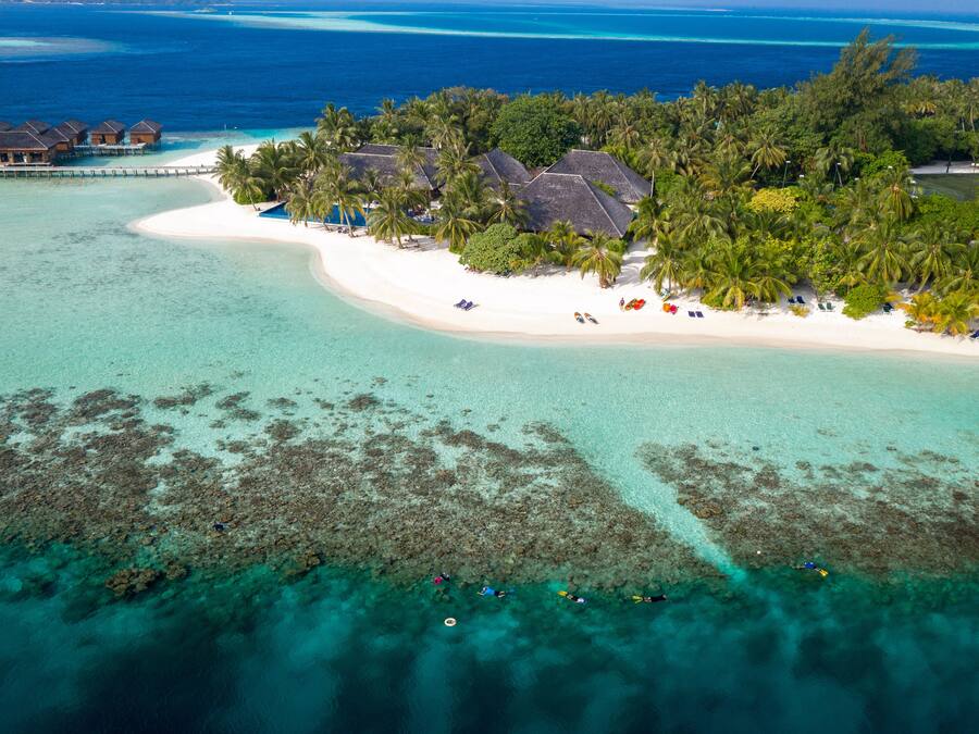 On the beach, white sand, beach towels, windsurfing