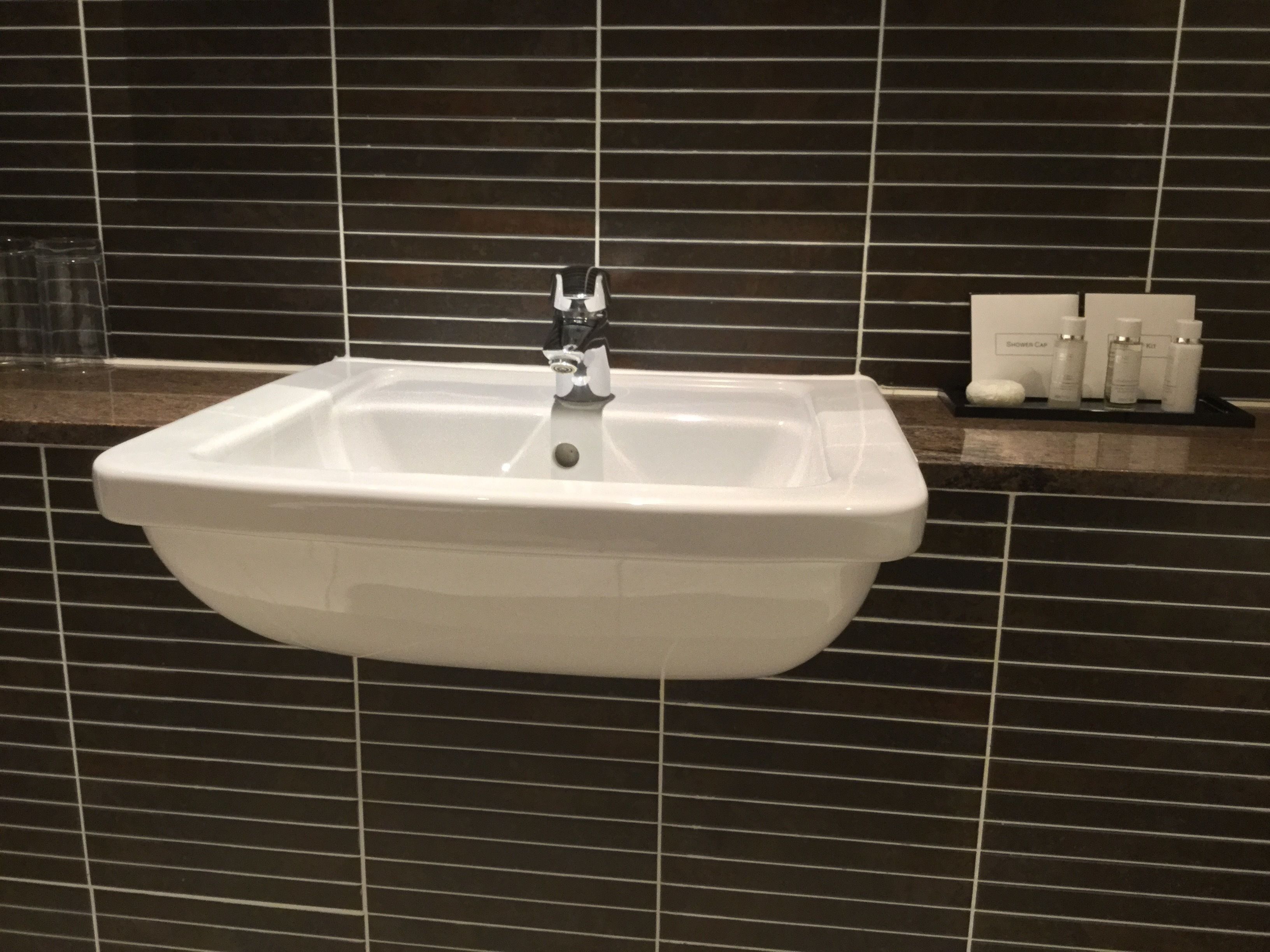 rainfall showerhead, designer toiletries, hair dryer, towels