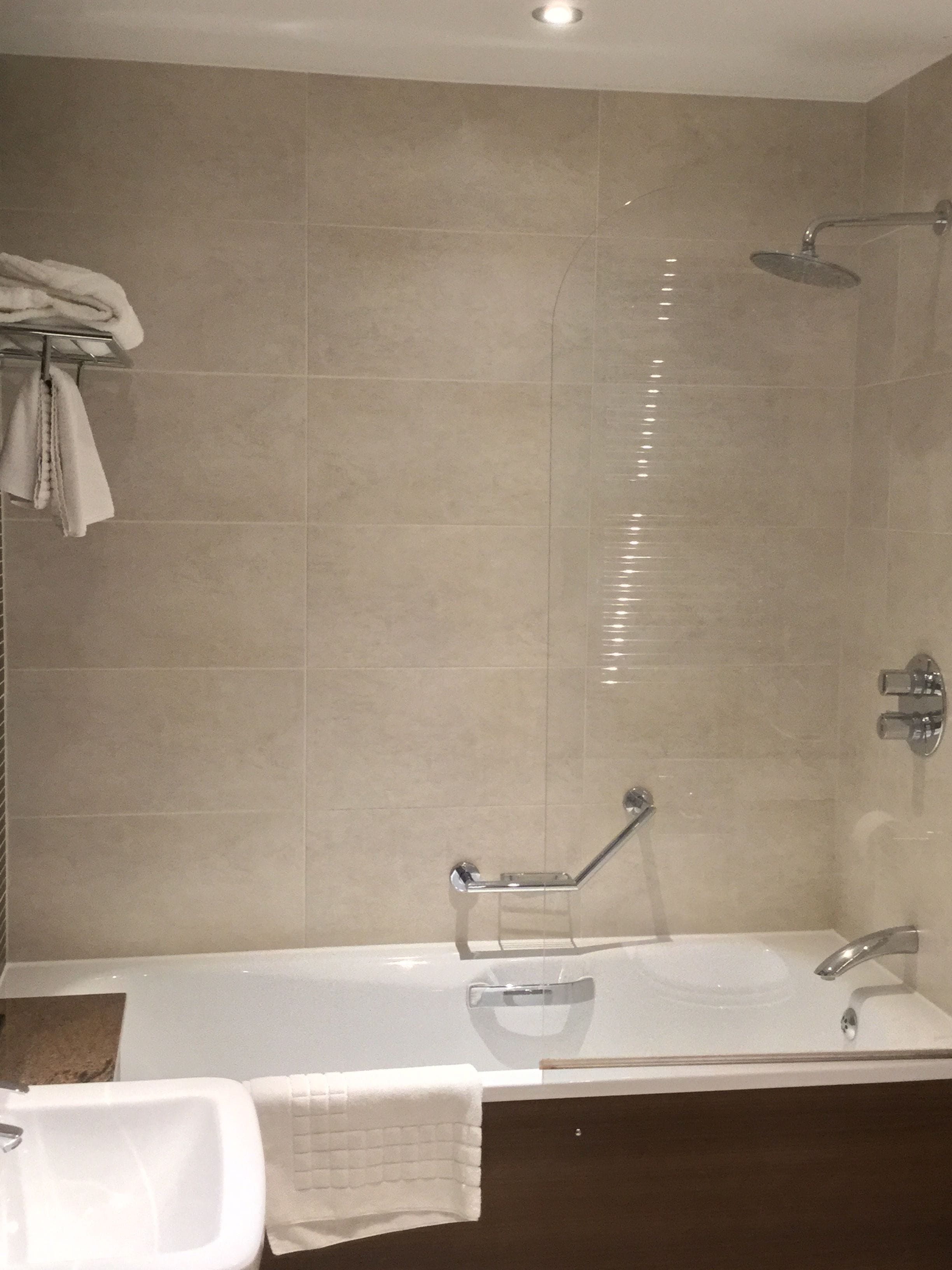 rainfall showerhead, designer toiletries, hair dryer, towels