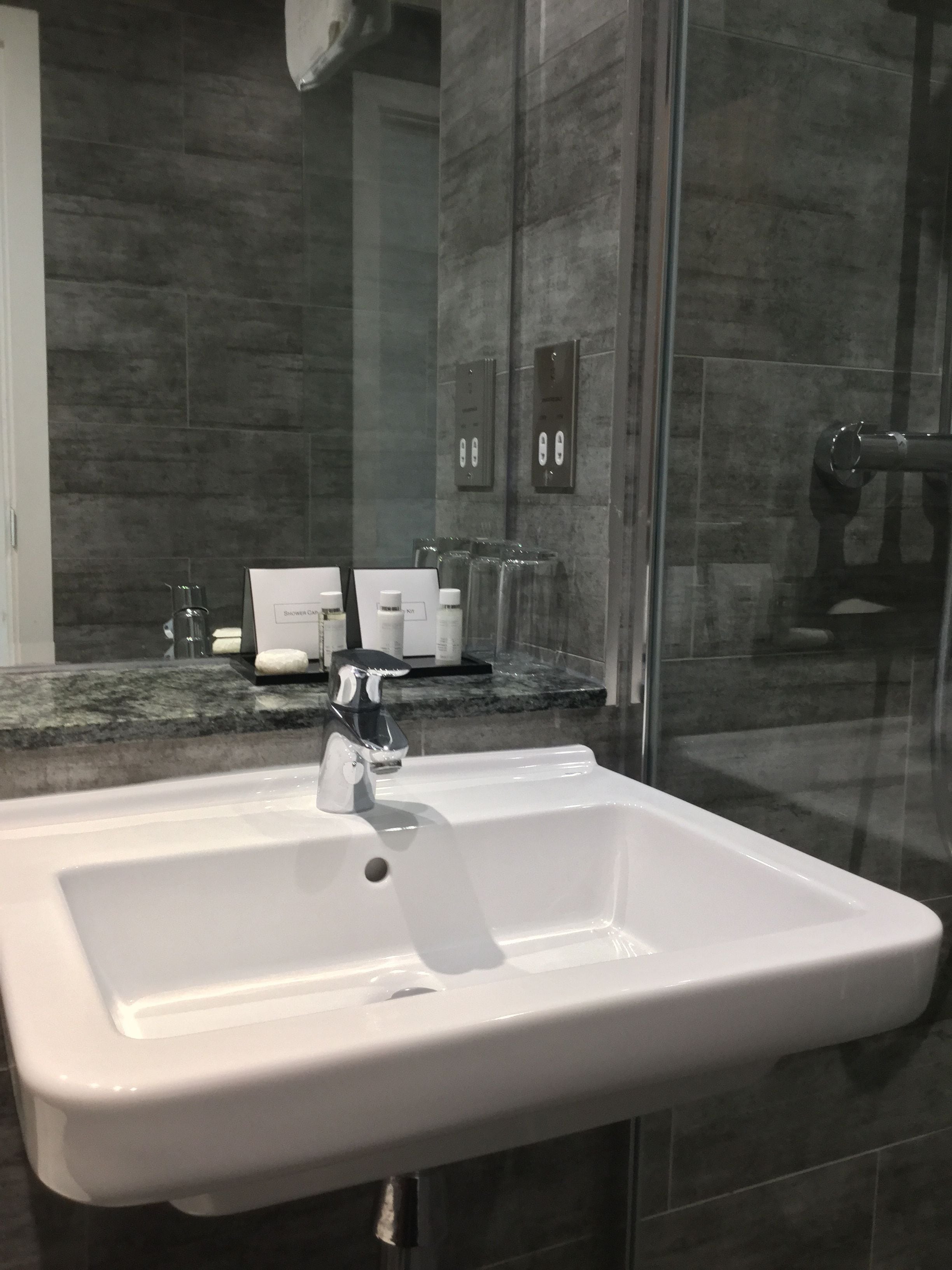 rainfall showerhead, designer toiletries, hair dryer, towels