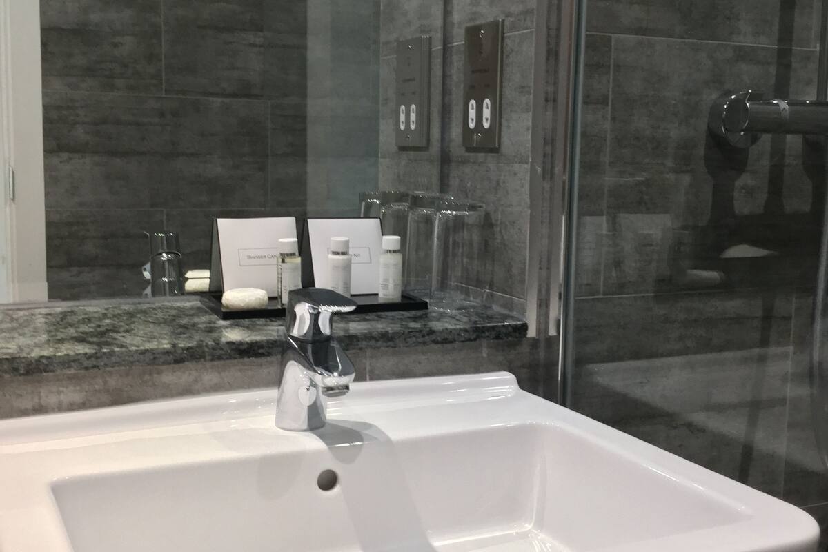 rainfall showerhead, designer toiletries, hair dryer, towels