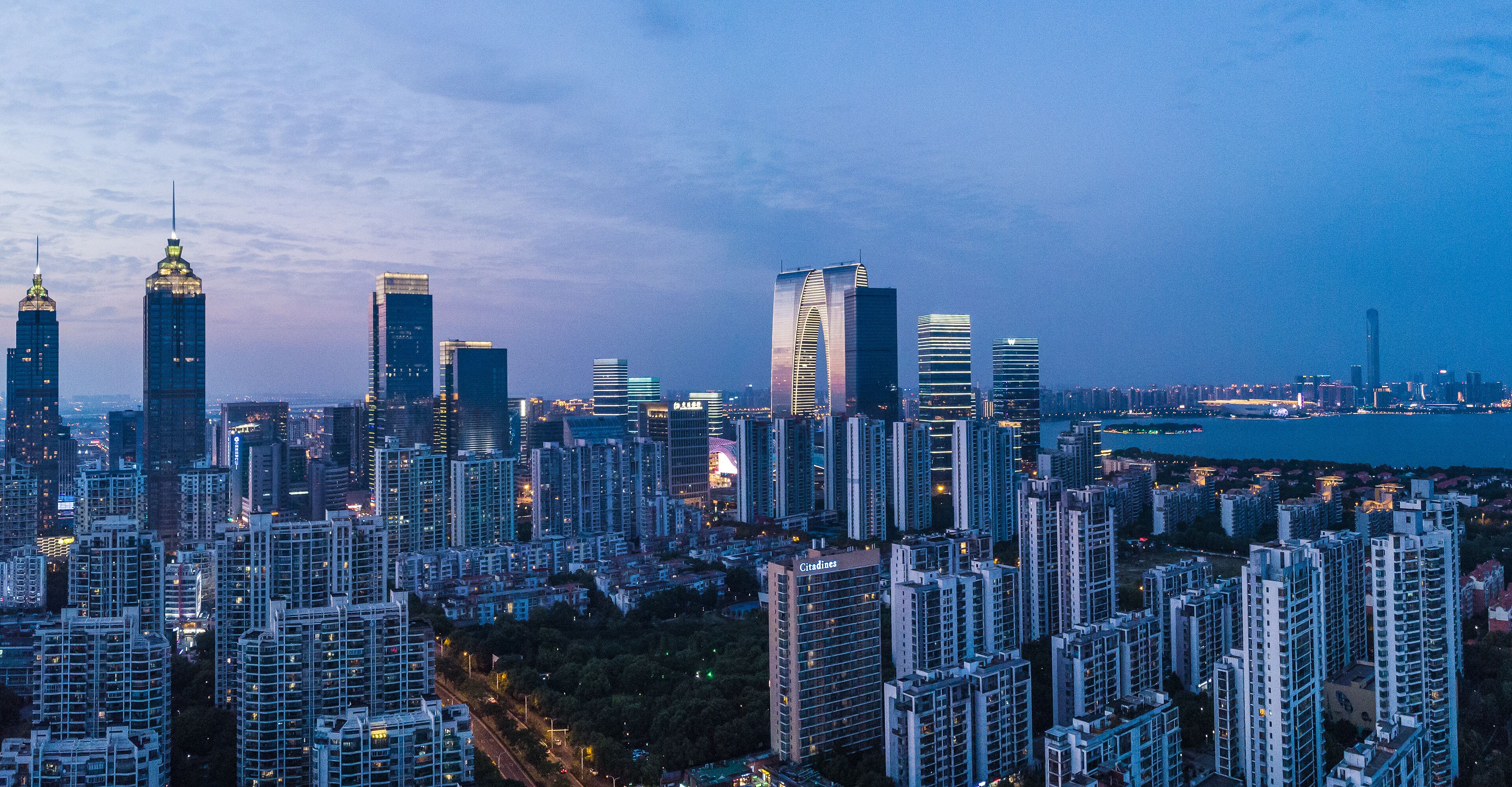 A high-rise urban skyline with modern architecture and dense building clusters.