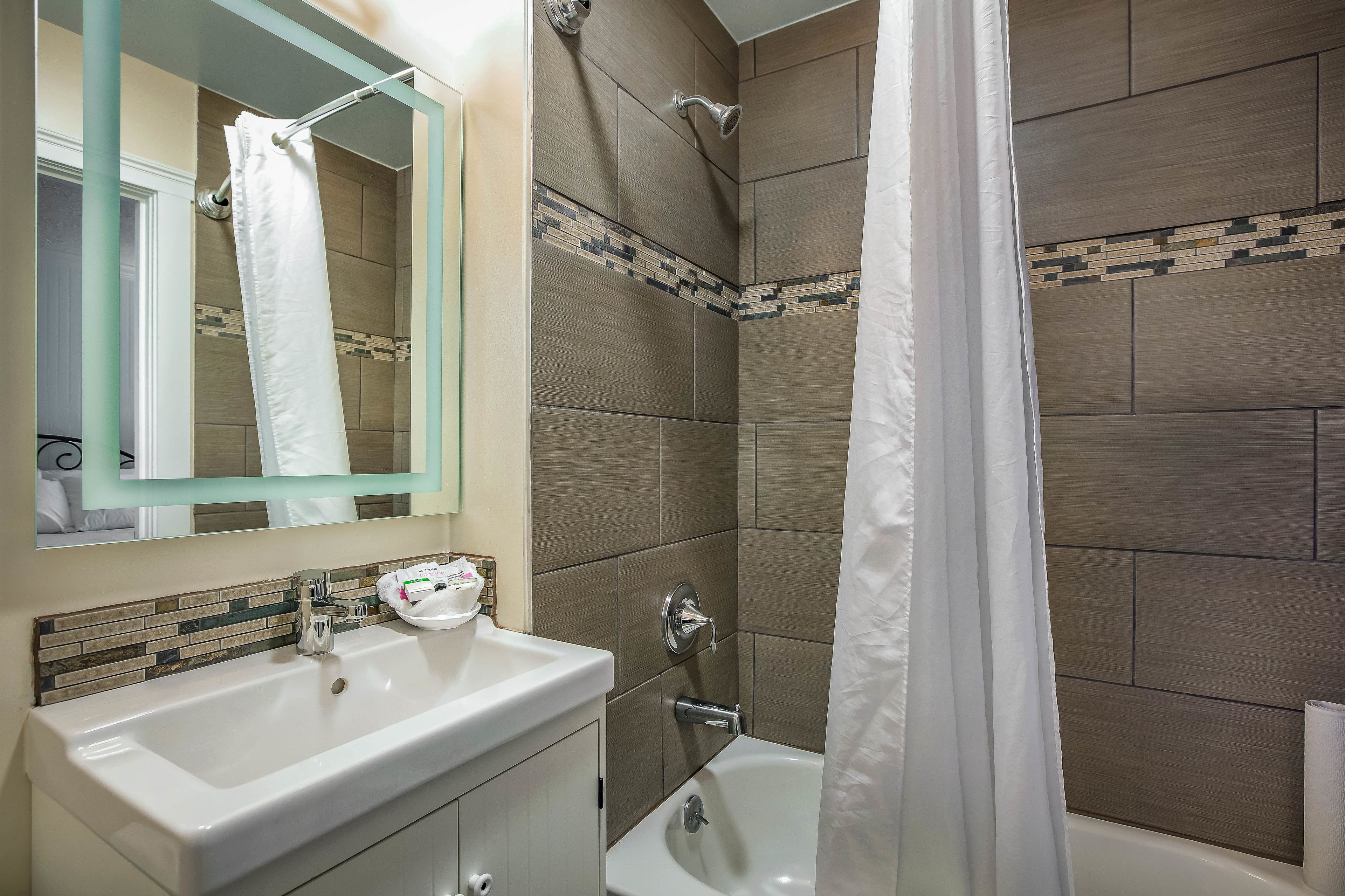 room, 2 double beds | bathroom | free toiletries, hair dryer, towels, soap