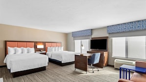 A hotel room with two beds, a desk, a chair, a TV, and a large window. - Hampton Inn & Suites Farmington (Farmington)