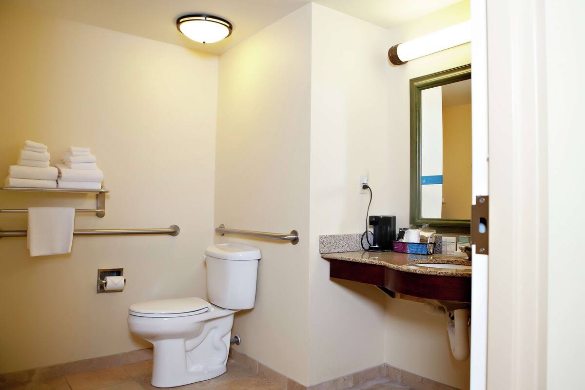 bathtub, hair dryer, towels