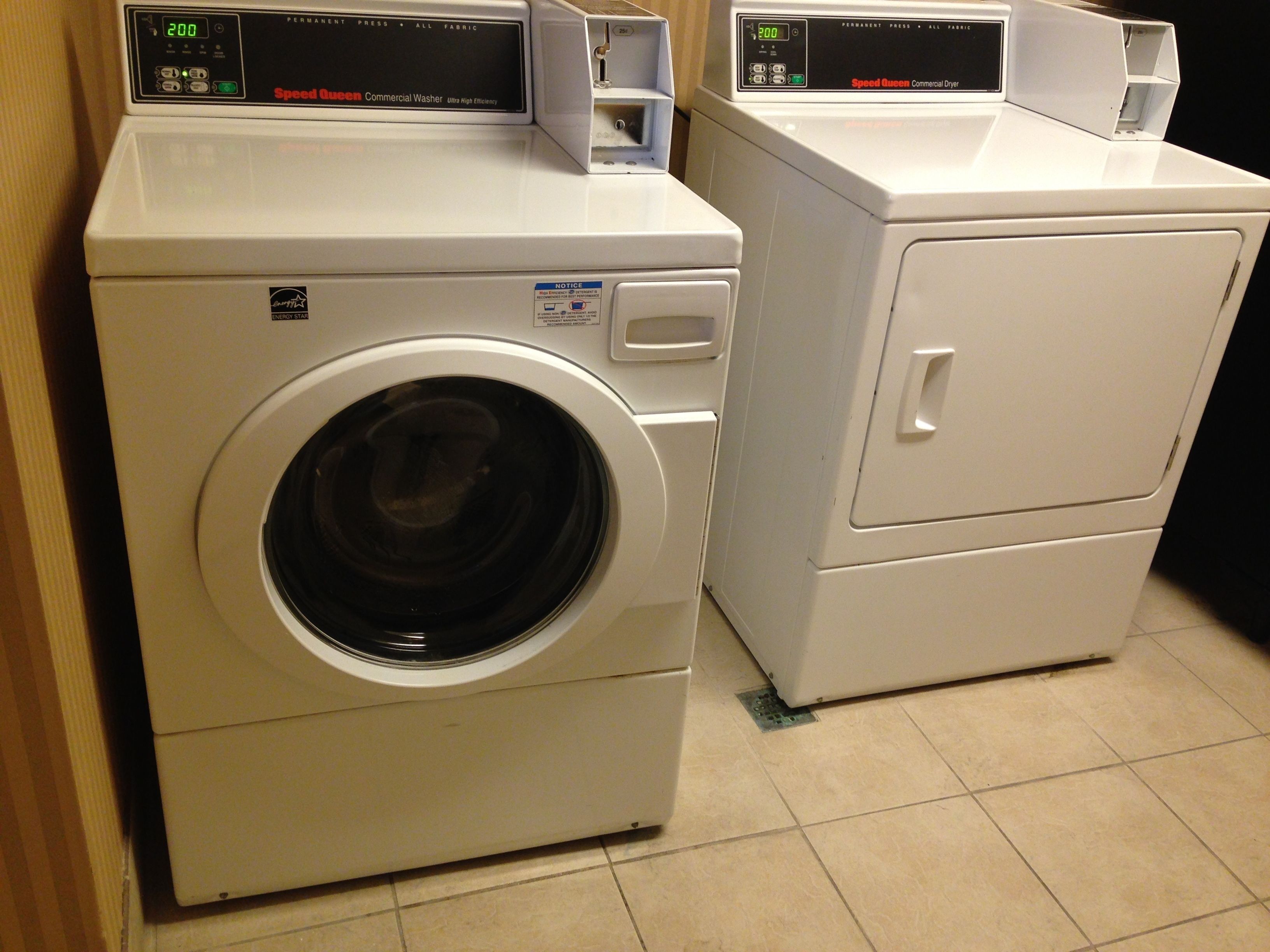 A front view of a Speed Queen Commercial Washer and Dryer unit.