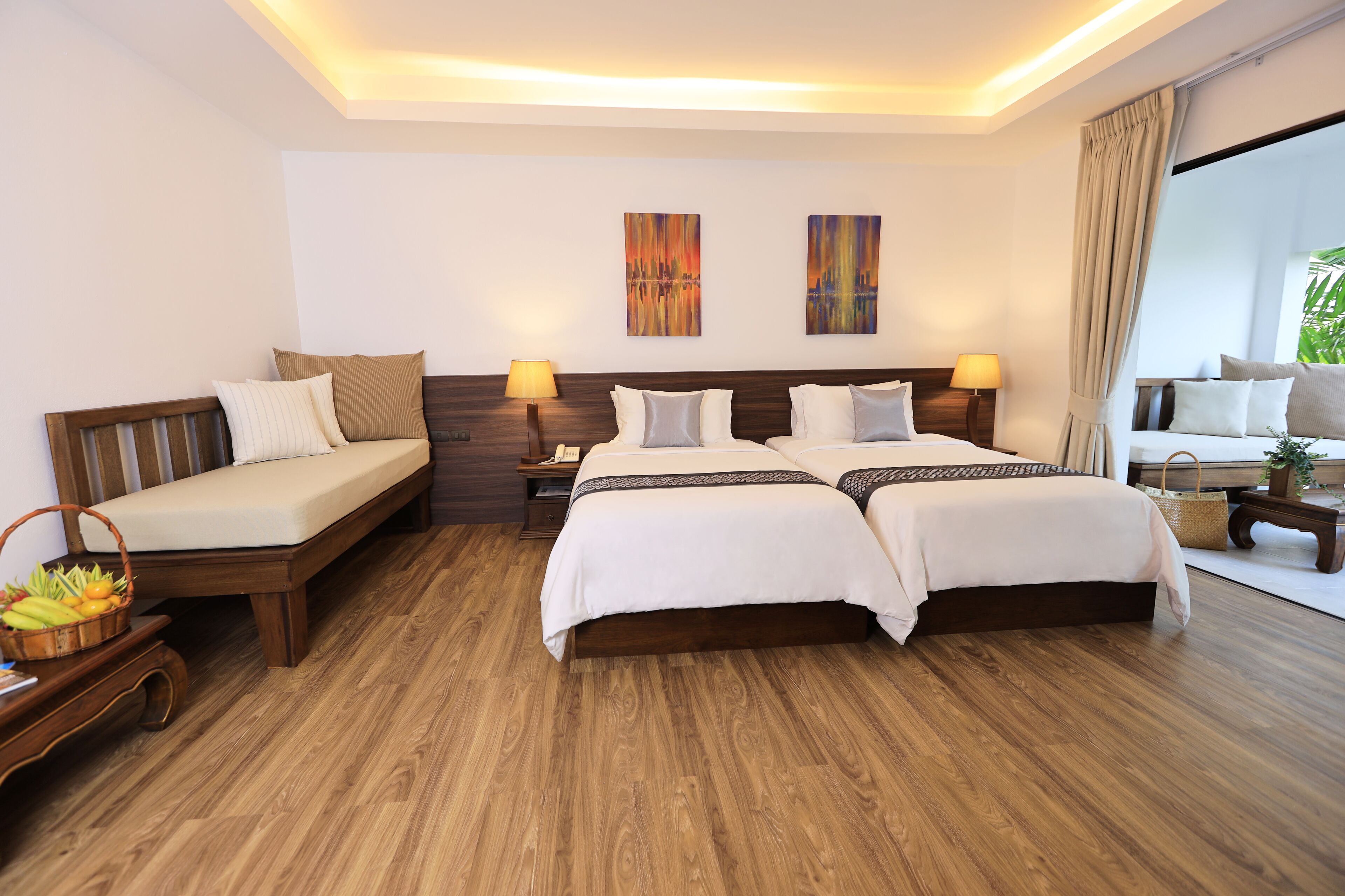 deluxe room | minibar, in-room safe, desk, iron/ironing board