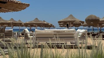 3 bars/lounges, poolside bar, beach bar