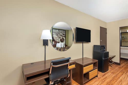 In-room safe, desk, iron/ironing board, cribs (free)