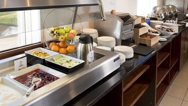 A buffet setup with various food items and a coffee station. - Holiday Inn Express Birmingham Star City by IHG (Birmingham)