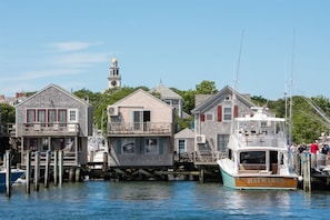 Waterfront homes with elevated balconies and traditional architecture, perfect for relaxation and maritime activities.