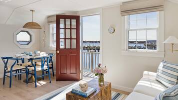 One Bedroom Cottage - Upper Mermansion | Living area | Flat-screen TV, books, video library