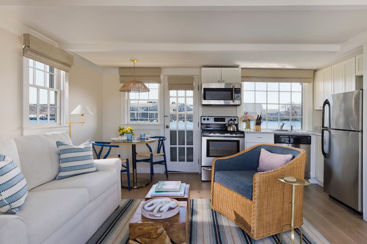 two bedroom cottage | living area | flat-screen tv, books, video library