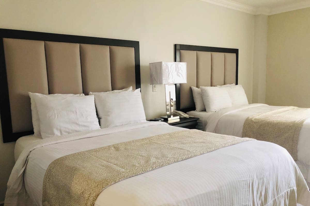 Standard Room with Two Queen Beds | In-room safe, desk, blackout curtains, free cots/infant beds