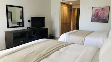 Standard Room with Two Queen Beds | In-room safe, desk, blackout drapes, free cribs/infant beds