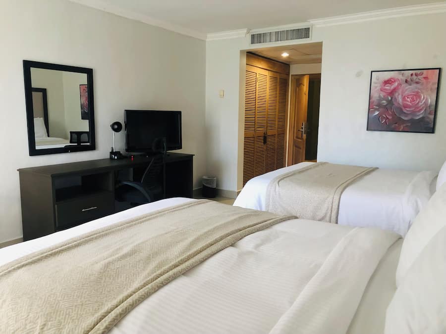 Standard Room with Two Queen Beds | In-room safe, desk, blackout drapes, free cribs/infant beds