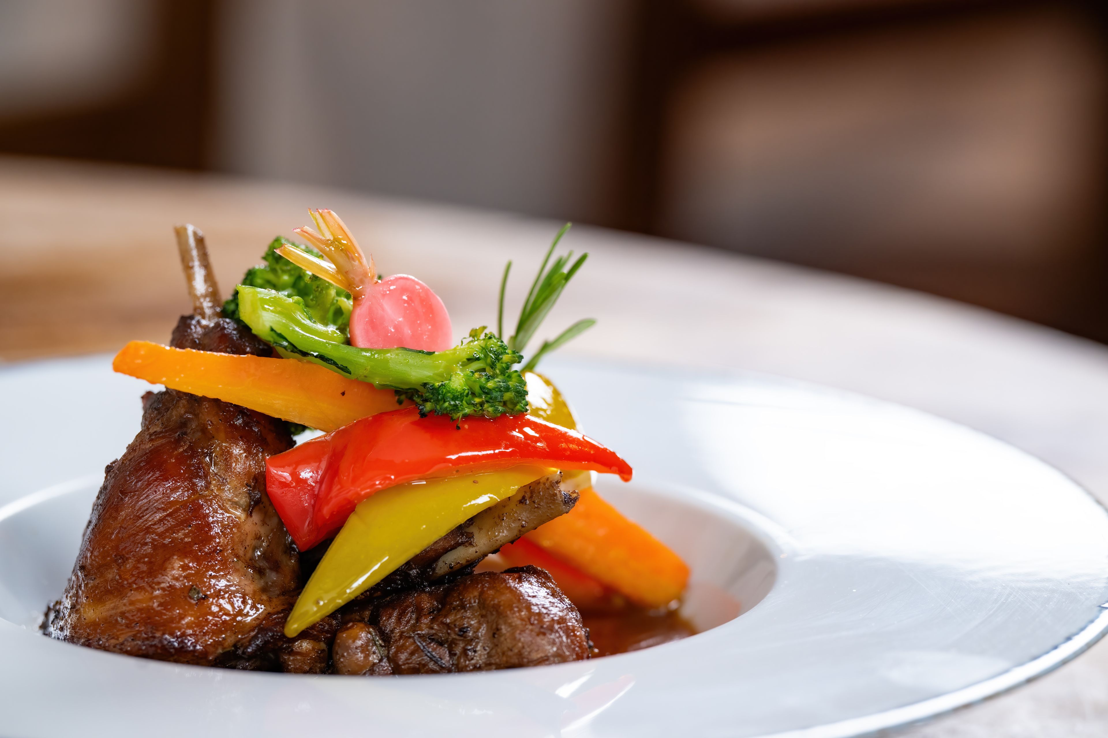 A plate of food with a variety of vegetables and meat.