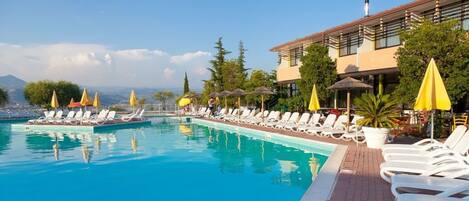 Outdoor pool, pool umbrellas, pool loungers