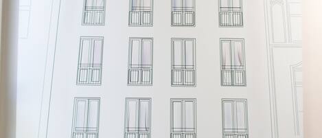 A line drawing of a building labeled 'town hotel' with multiple windows and a bicycle at the entrance.