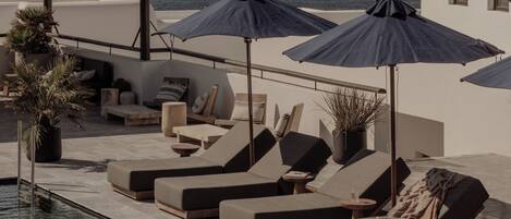 Outdoor pool, open 8:00 AM to 8:00 PM, pool umbrellas, pool loungers