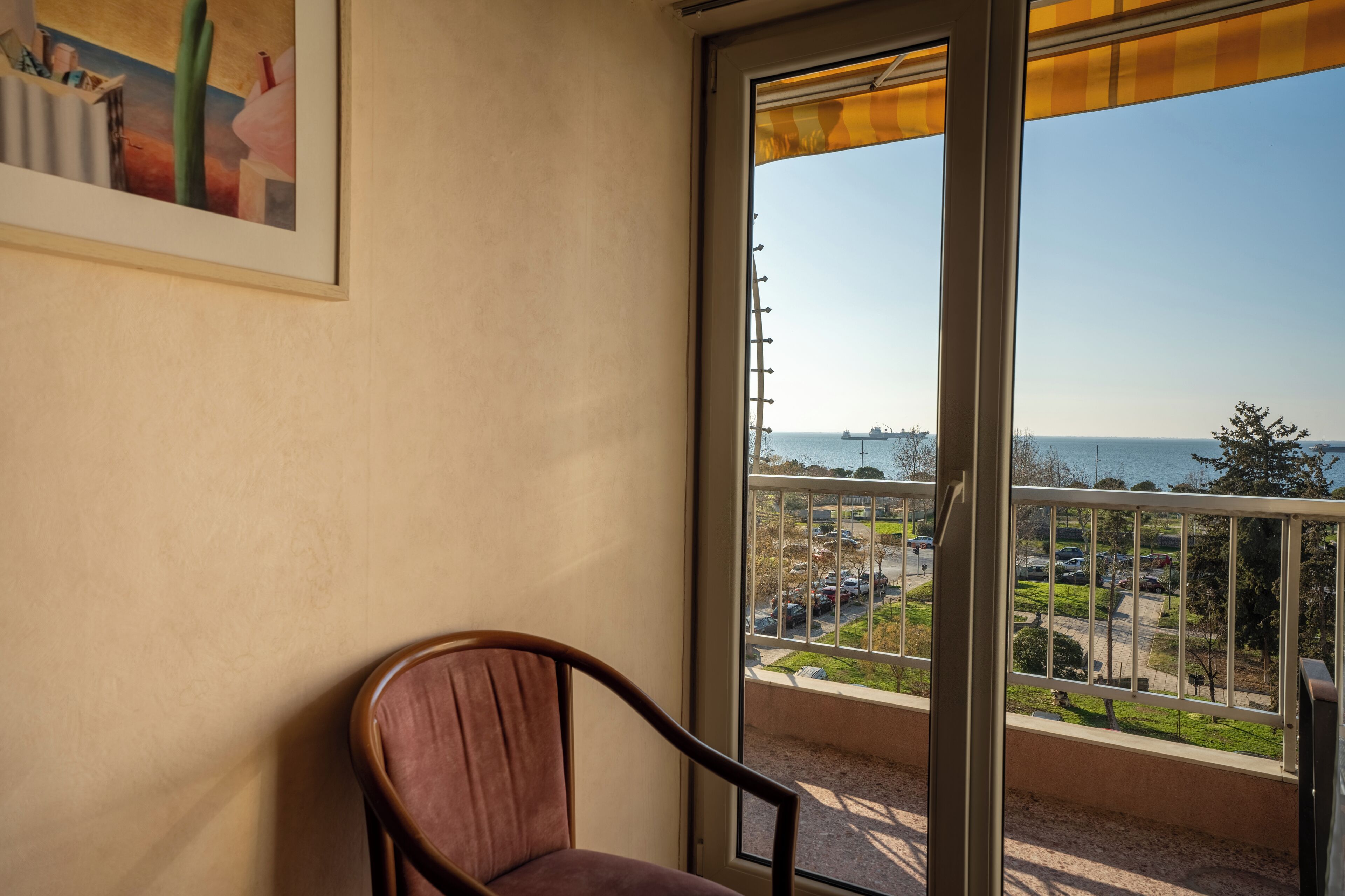 Triple Room, Balcony, Sea View | Minibar, in-room safe, desk, blackout drapes
