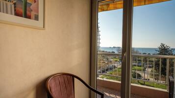 Triple Room, Balcony, Sea View | Minibar, in-room safe, desk, blackout drapes