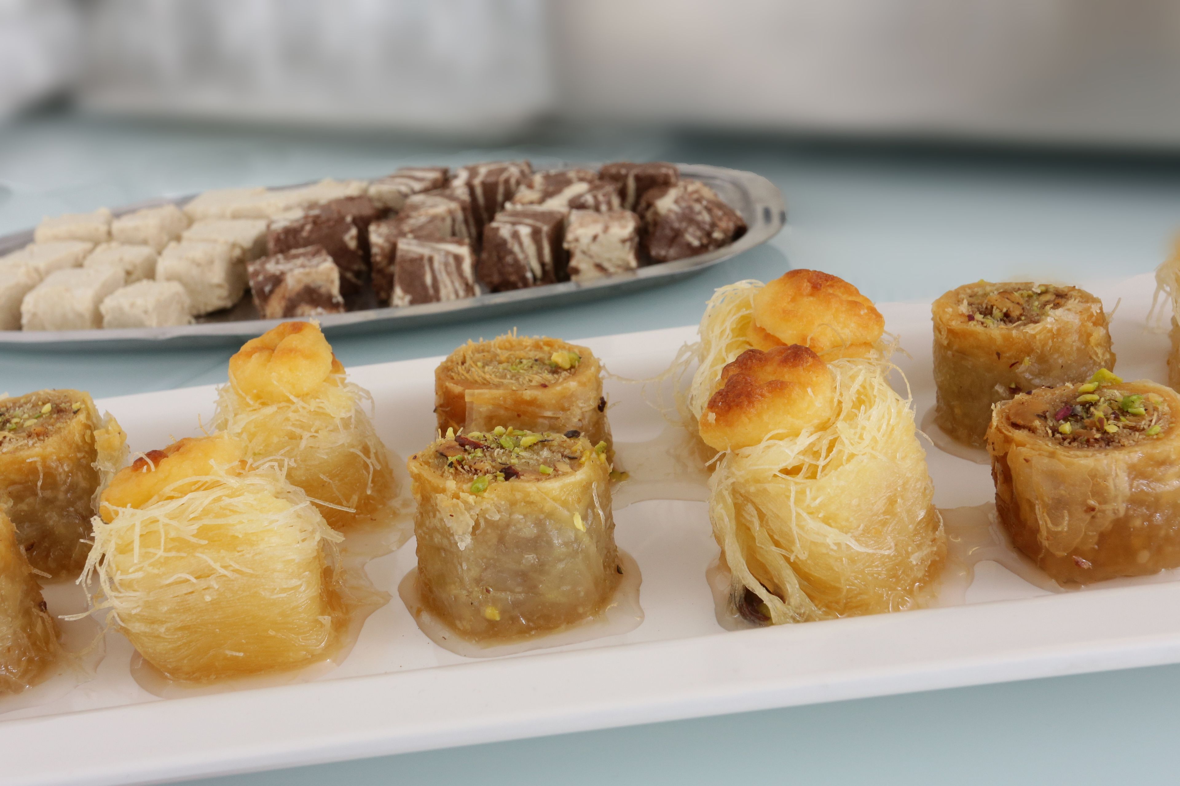 A plate of baklava and other desserts.