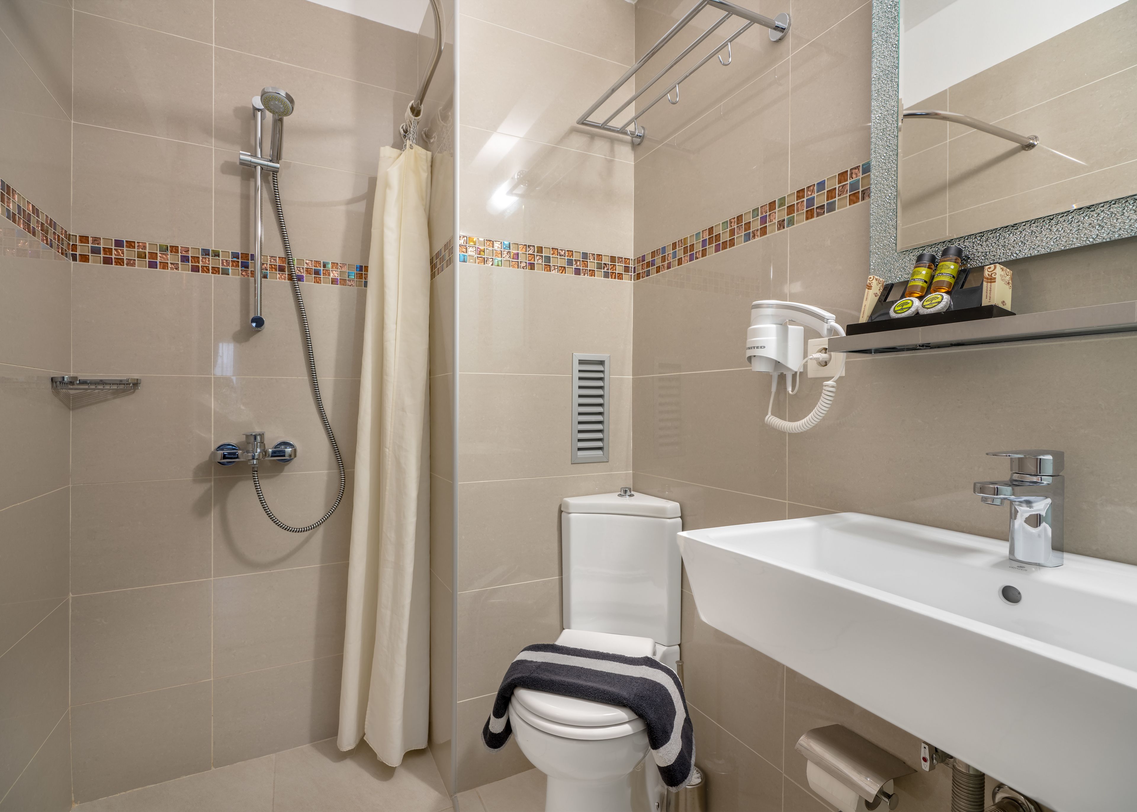 shower, eco-friendly toiletries, hair dryer, slippers