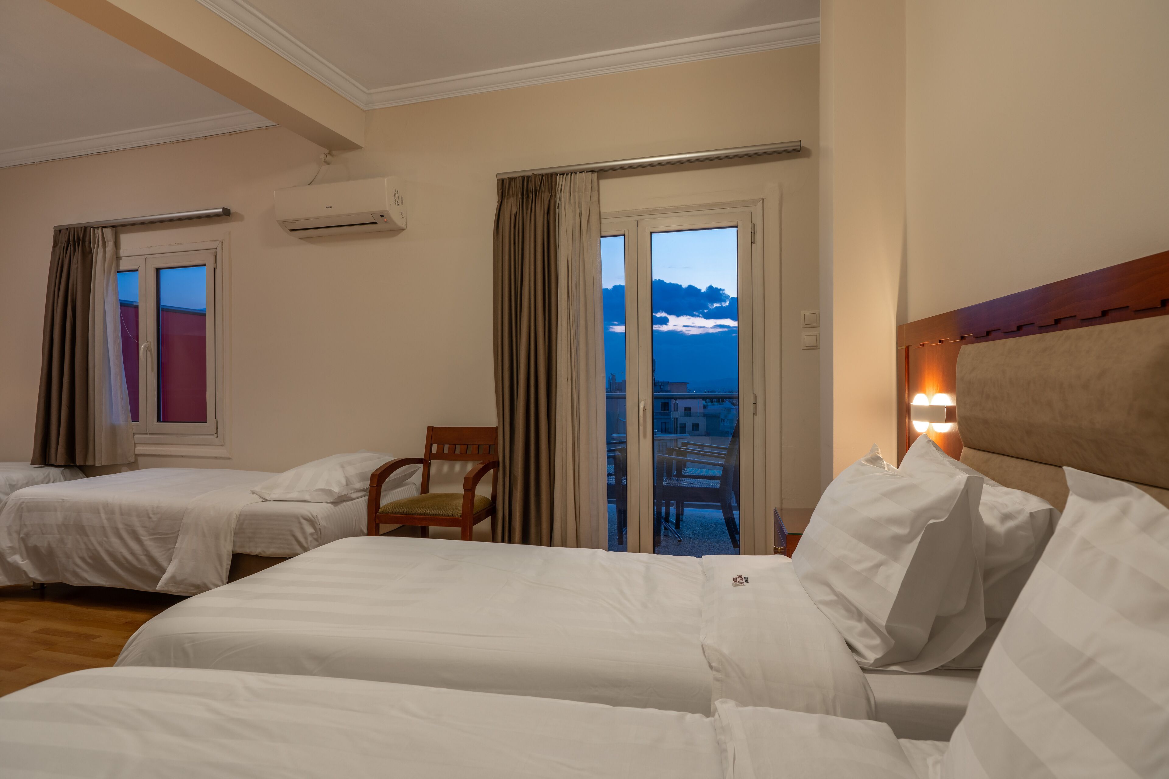 quadruple room | premium bedding, select comfort beds, in-room safe