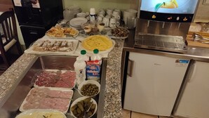 A breakfast buffet with various meats, cheeses, and condiments. - Penzion Kovac (Radovljica)
