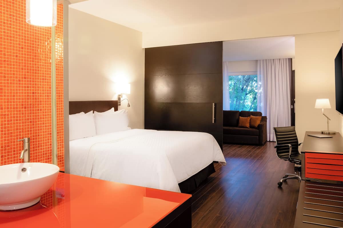 junior suite, 1 king bed | in-room safe, desk, iron/ironing board, free wifi