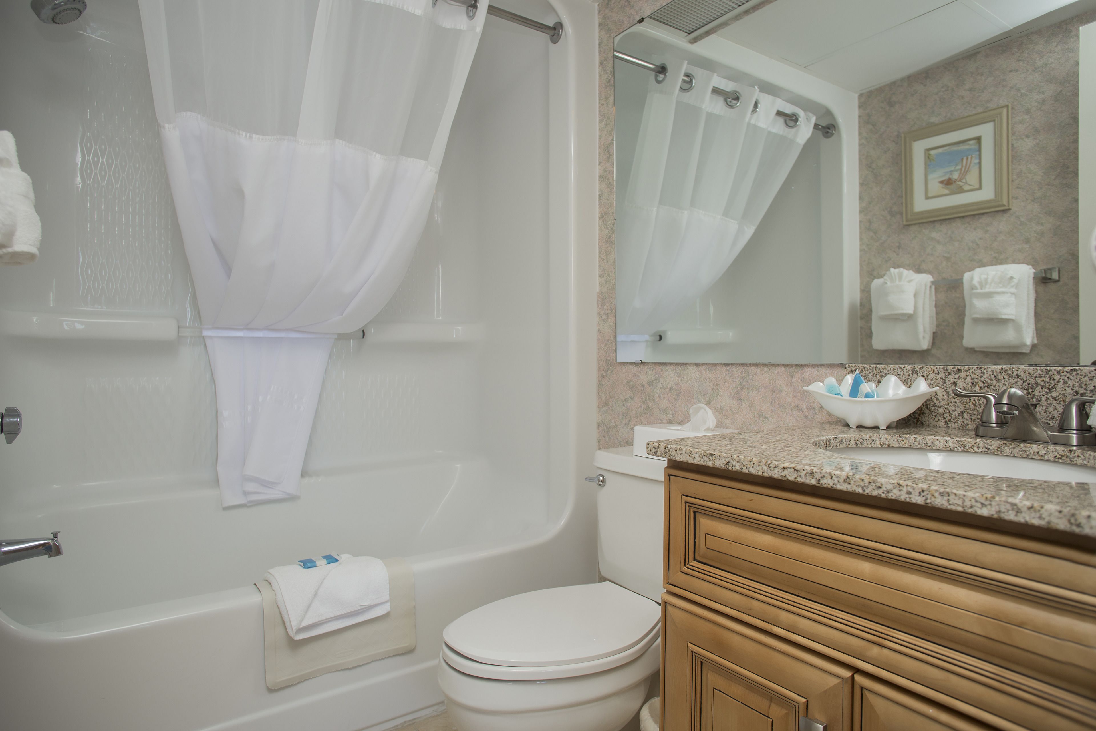 condo, 2 bedrooms | bathroom | combined shower/bathtub, free toiletries, hair dryer, towels