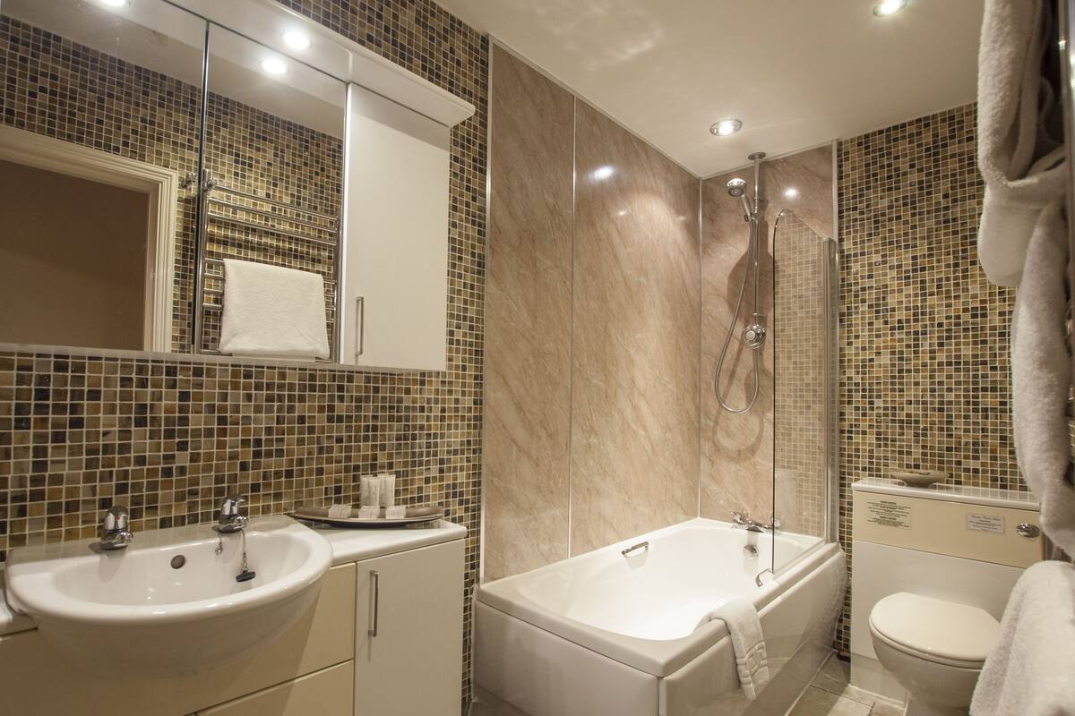 ashton suite, 1 king bed | bathroom | eco-friendly toiletries, hair dryer, towels