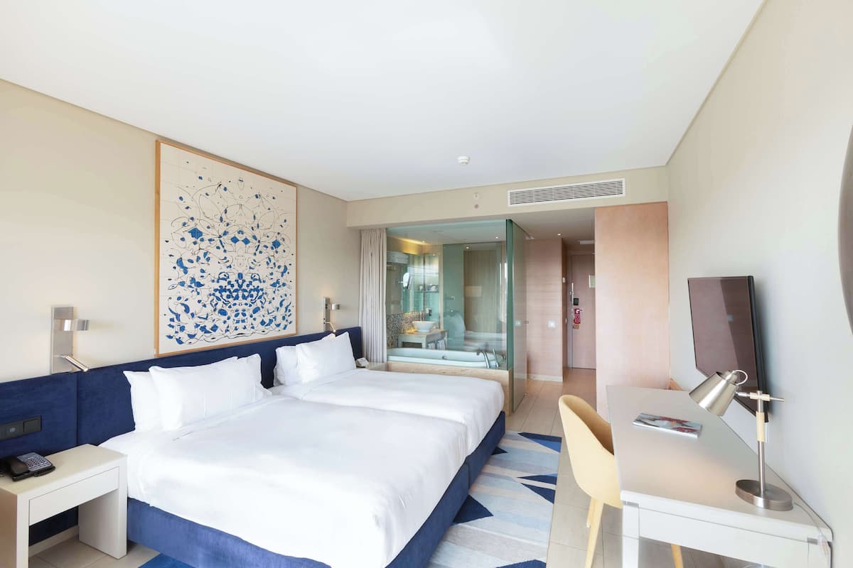 Premium bedding, memory-foam beds, minibar, in-room safe