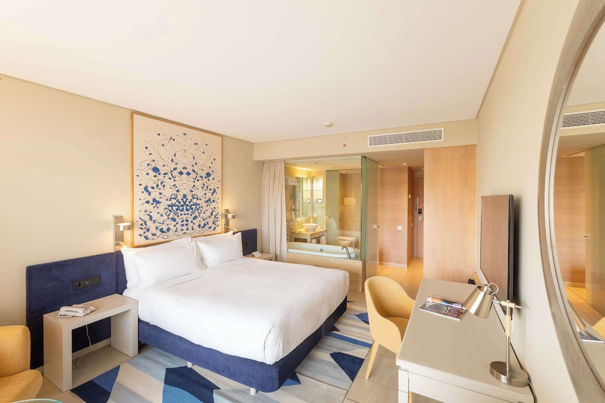 Premium bedding, memory-foam beds, minibar, in-room safe