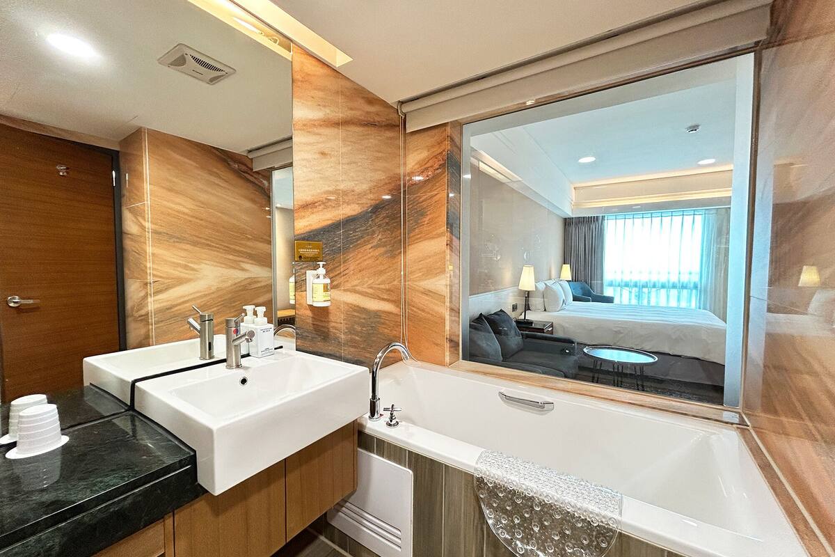 classic double room | bathroom | hair dryer, towels, shampoo, toilet paper